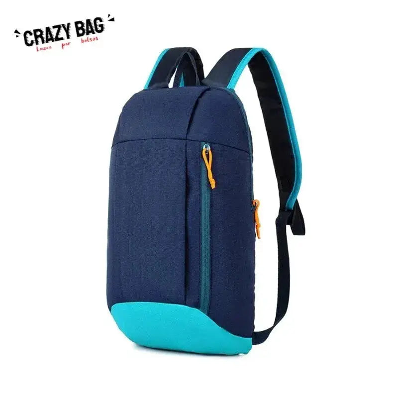 Men's outdoor lightweight backpack, navy blue with turquoise base and orange zipper pulls, Crazy Bag logo