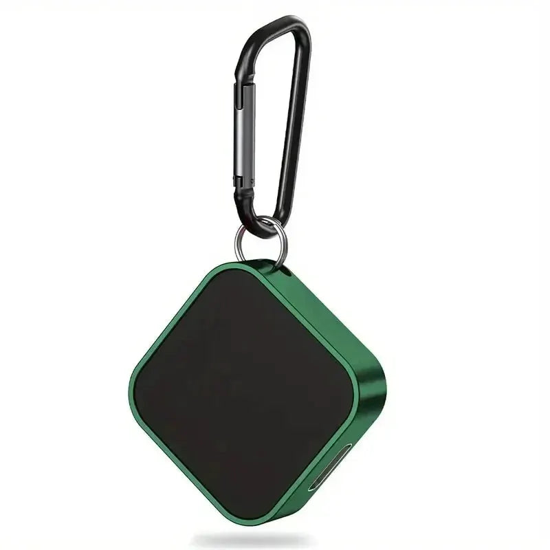 Portable wireless watch charger, green square body with black charging surface and carabiner clip for on-the-go use