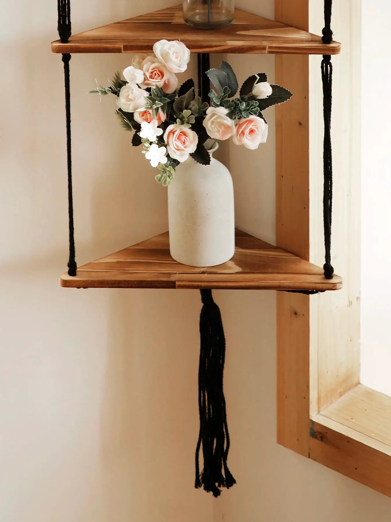 2-tier wood triangle floating wall shelf by Simples Market with black rope hangers, peach roses in a white vase