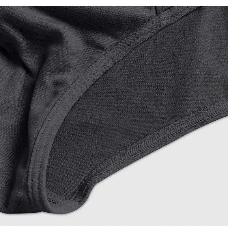 Men's briefs, black breathable fabric with elastic stitching close-up