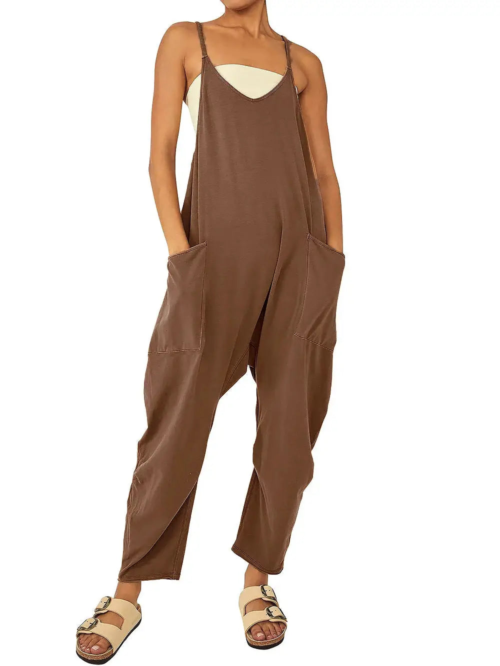 Brown loose-fit women's suspender jumpsuit with large patch pockets and slim straps.