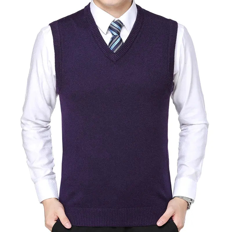 Men's purple sweater vest by Simples Market over a white dress shirt with striped tie