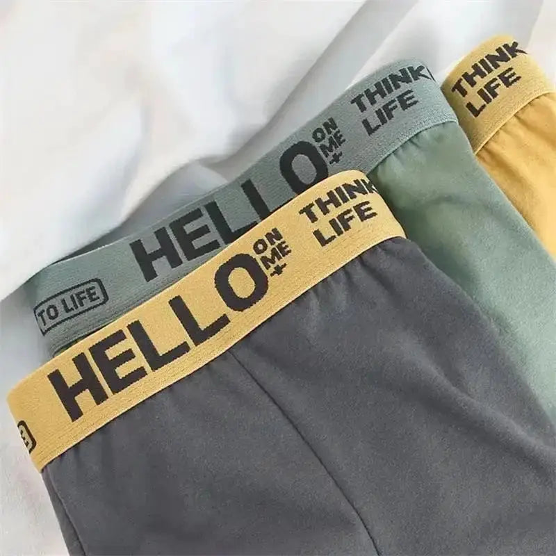 4-pack men's boxer shorts; multi-color, high-stretch breathable fabric with bold elastic waistbands.