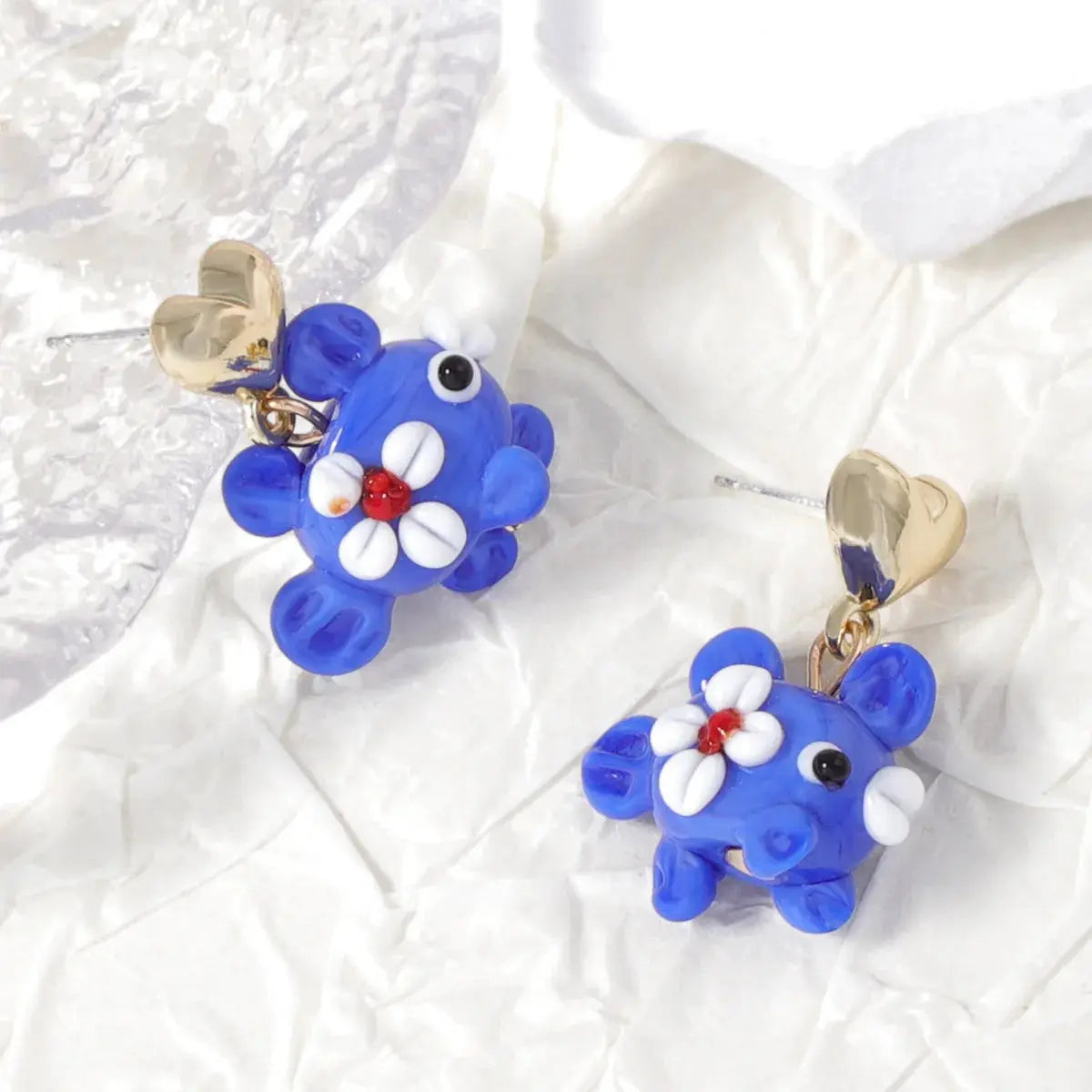 Cute blue octopus earrings with white flower accents, red centers, glass long-drop design, gold heart posts (pair)