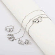 Five-piece silver-tone heart-shaped rhinestone jewelry set for women with rings, earrings, necklace, and bracelet
