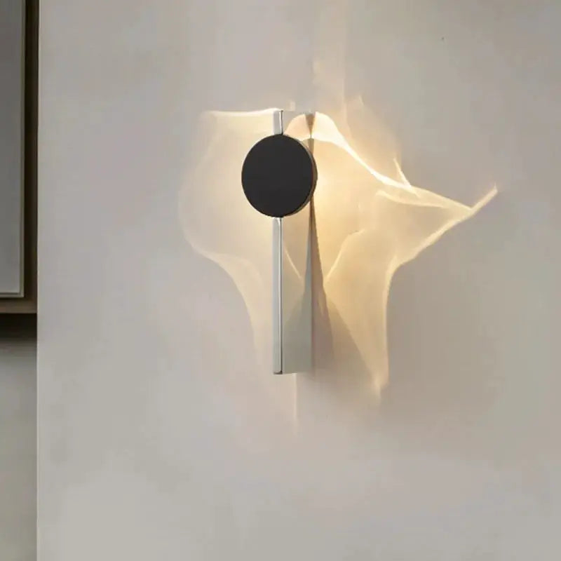 Simples Market modern LED wall light with rotatable black round disc and stainless steel arm, bedside wall sconce