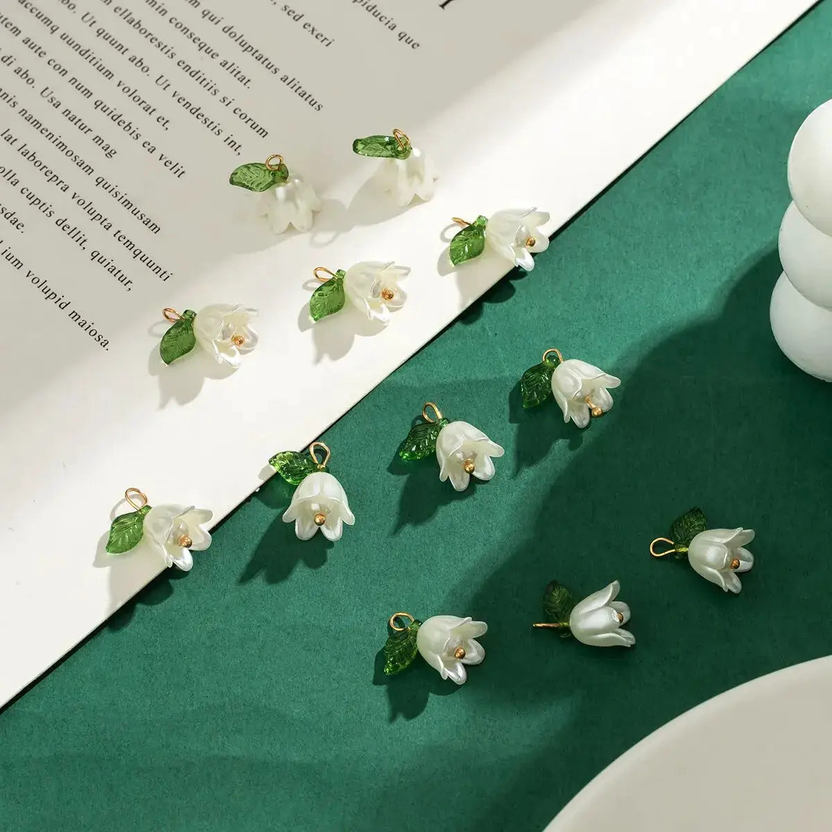 Orchid flower charms, 10 pieces, white petals with imitation pearl centers and green leaves, gold loops