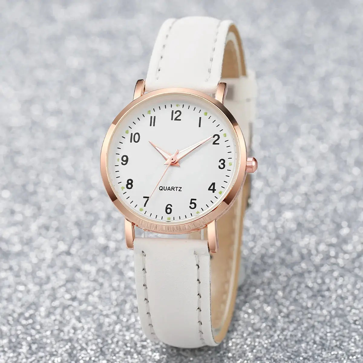 Women’s white leather strap quartz watch with rose-gold case and Arabic numeral dial