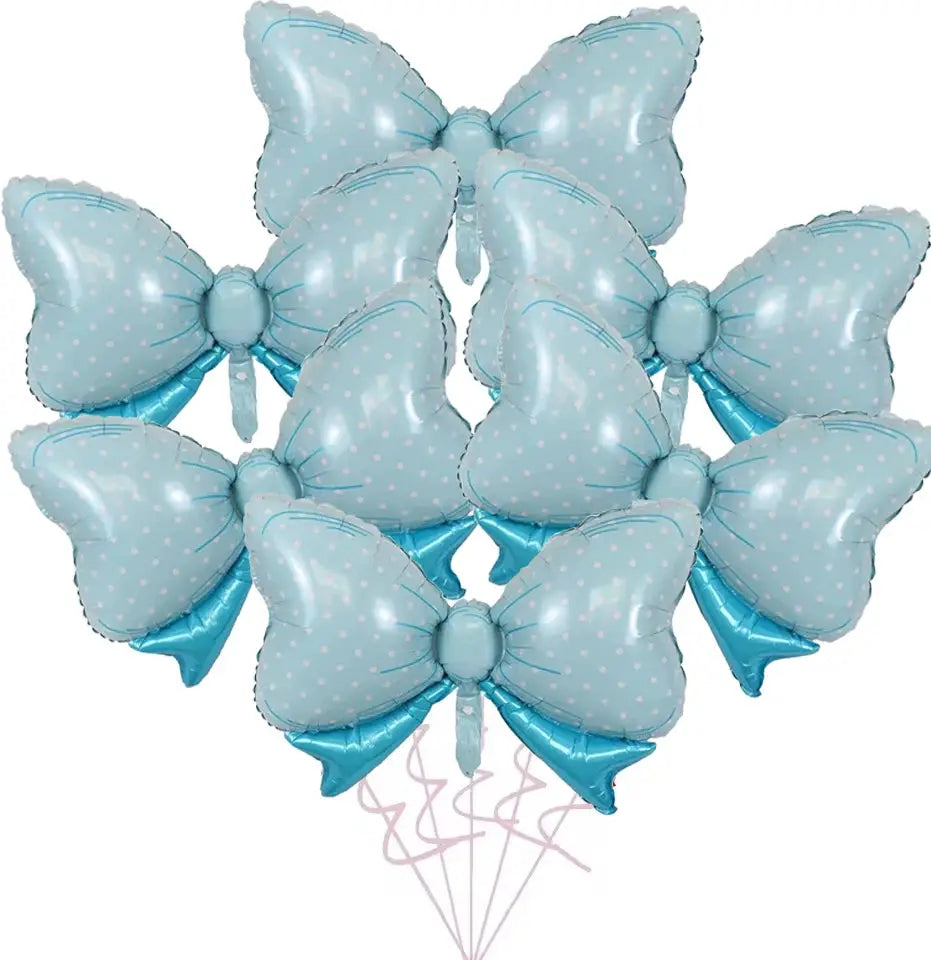 Six blue bow-shaped aluminum foil balloons with white polka dots and pink tails