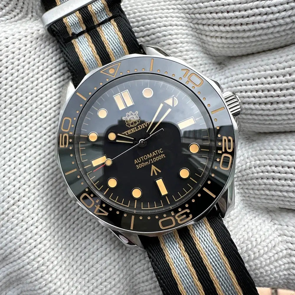 STEELDIVE SD1957 diver watch, 42mm black dial, gold-tone ceramic bezel, NH35 auto, striped NATO strap