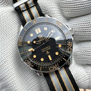 STEELDIVE SD1957 diver watch, 42mm black dial, gold-tone ceramic bezel, NH35 auto, striped NATO strap