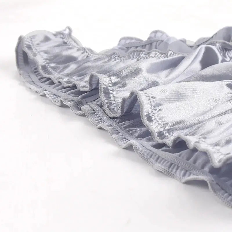 Women's low-waist satin briefs with ruffled trim in light gray