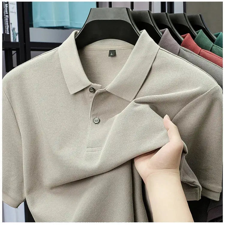 Men's beige 100% cotton polo shirt with classic collar in breathable pique knit, displayed on hangers.