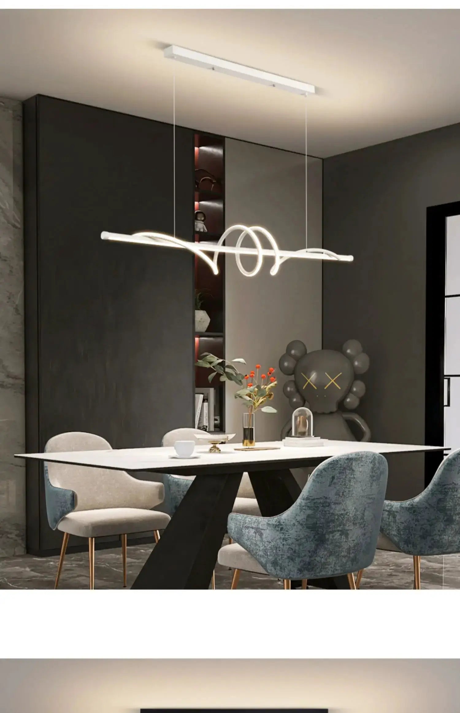 Modern white LED pendant light fixture with looping rings over a dining table in a contemporary living room