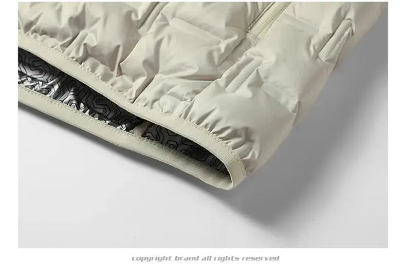 Winter white men's down jacket cuff close-up with inner geometric patterned lining