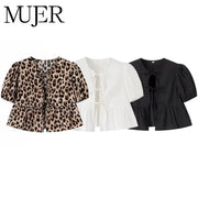 Leopard print crop top set by MUJER; three puff-sleeve blouses in leopard, white, and black
