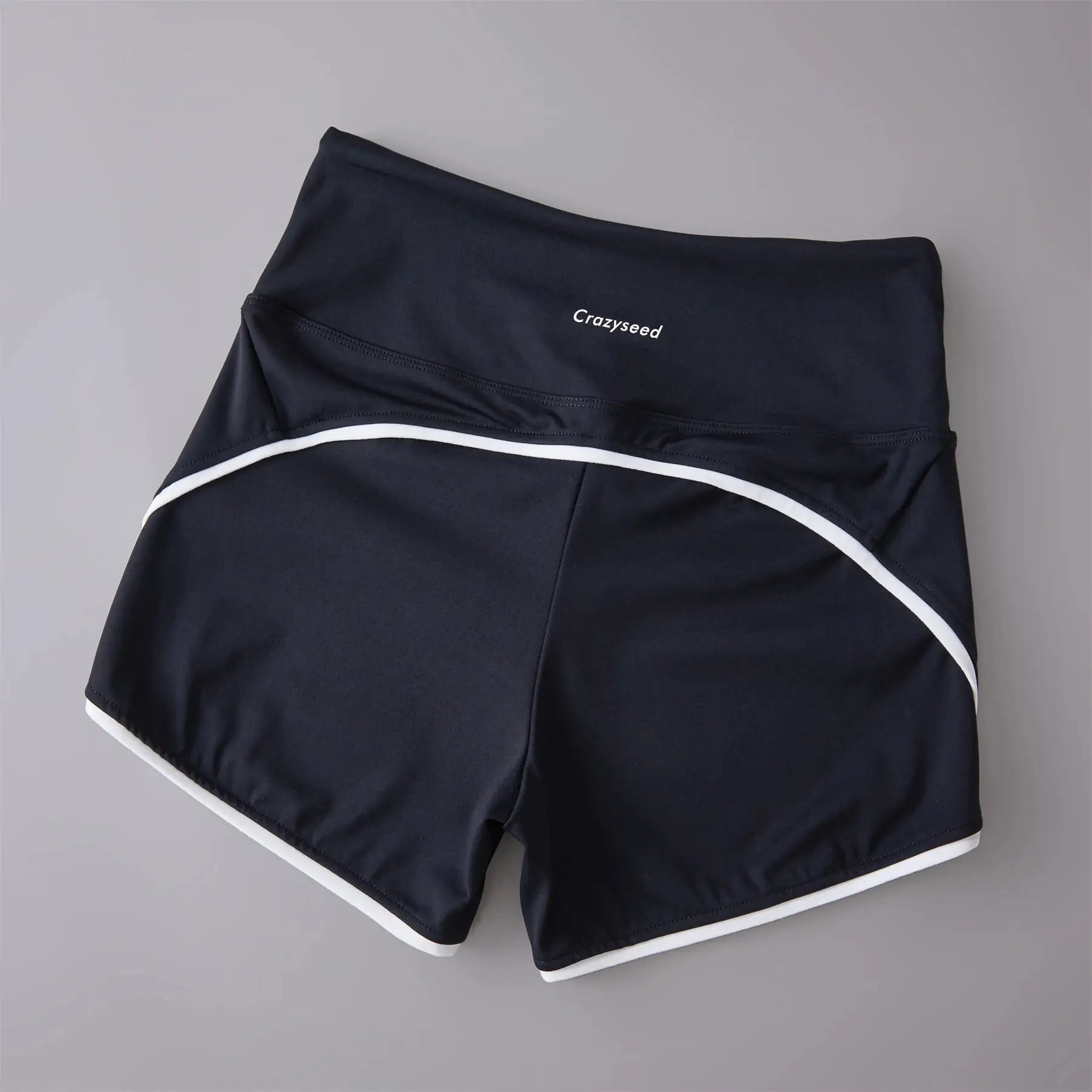 Sports shorts in navy with white piping, high-waist design, Crazyseed logo