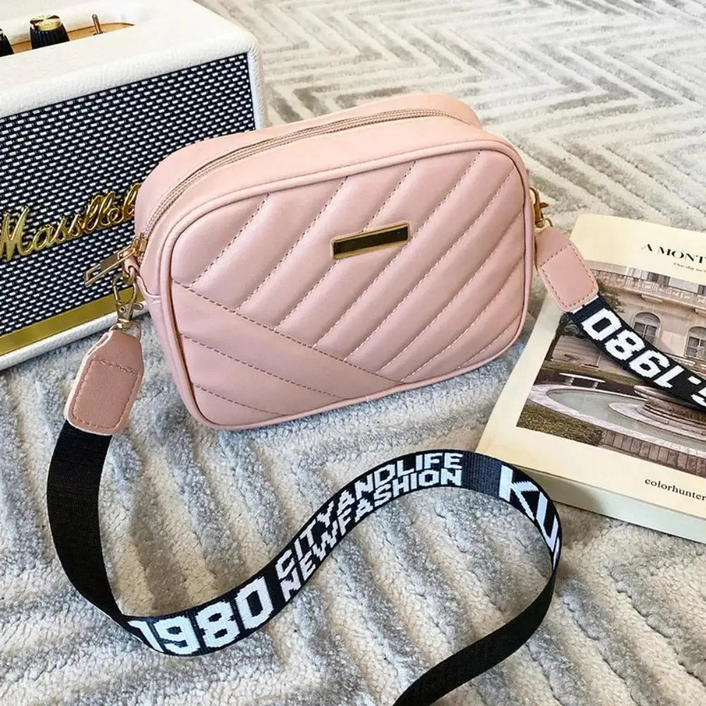 Pink quilted PU shoulder bag with diagonal stitching, gold plaque, and crossbody strap (Simples Market)