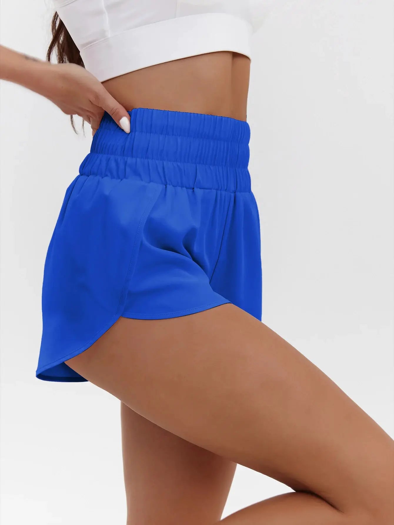 Women's blue high-waist athletic shorts with elastic waistband and quick-dry breathable fabric