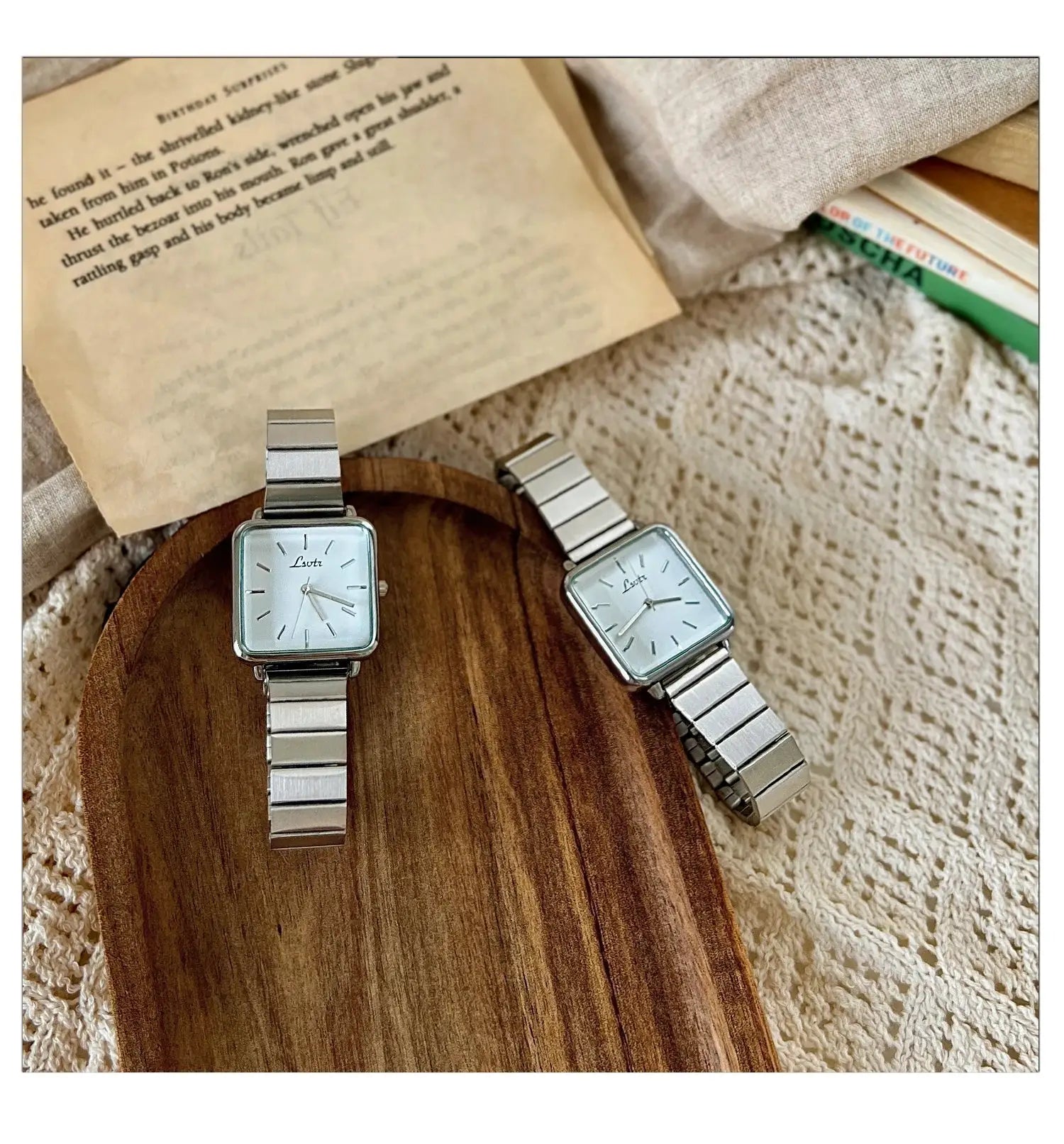 Two silver stainless-steel square-faced women's watches with metal link bands