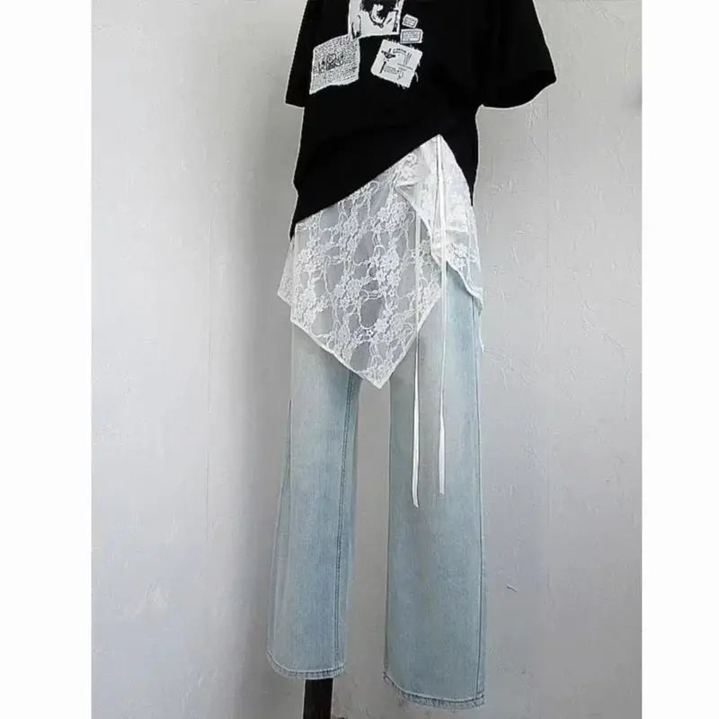 Simples Market wrap lace overlay skirt with white lace drape over light-wash denim pants