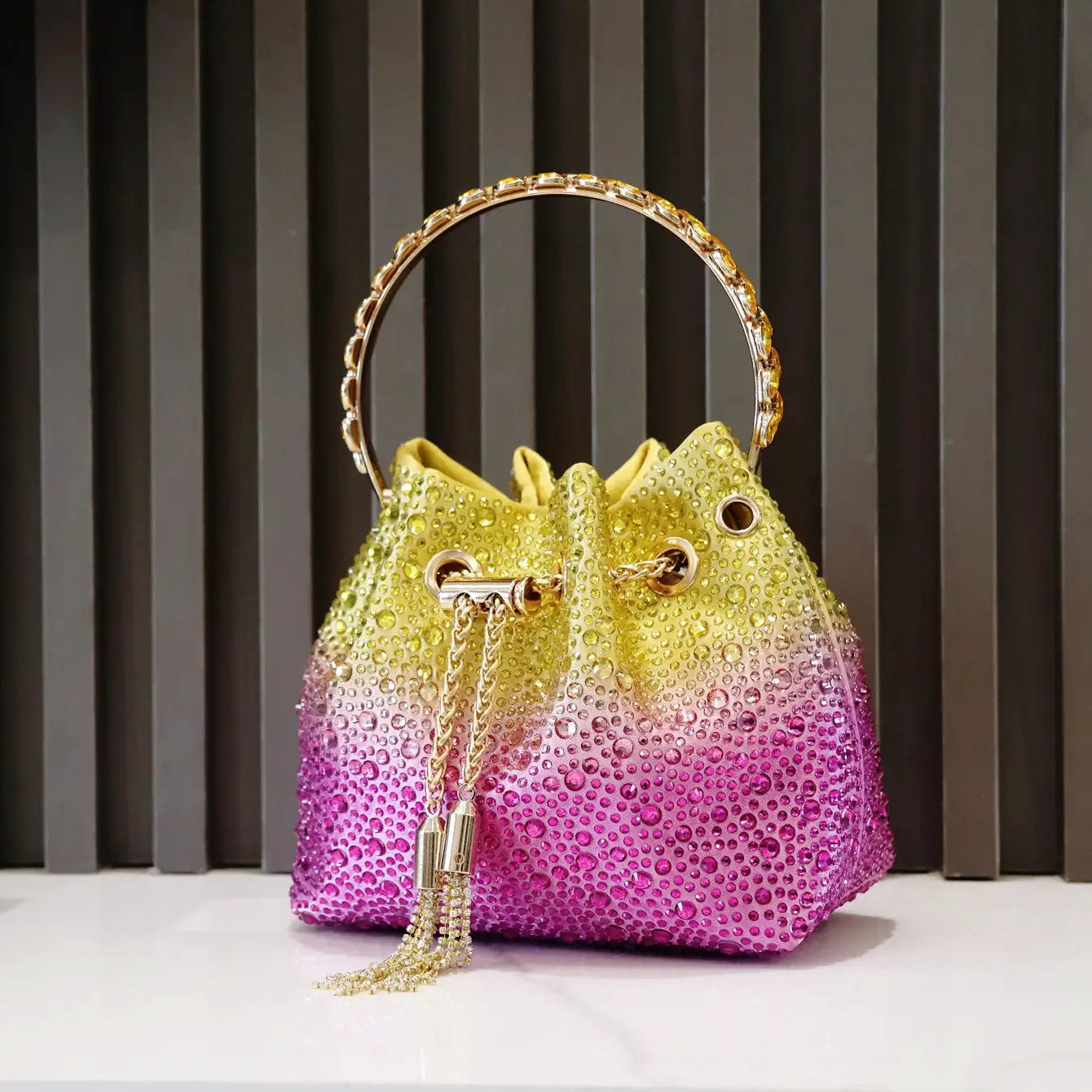 Rhinestones evening clutch bag by Simples Market with gradient yellow-to-pink color and gold ring handle