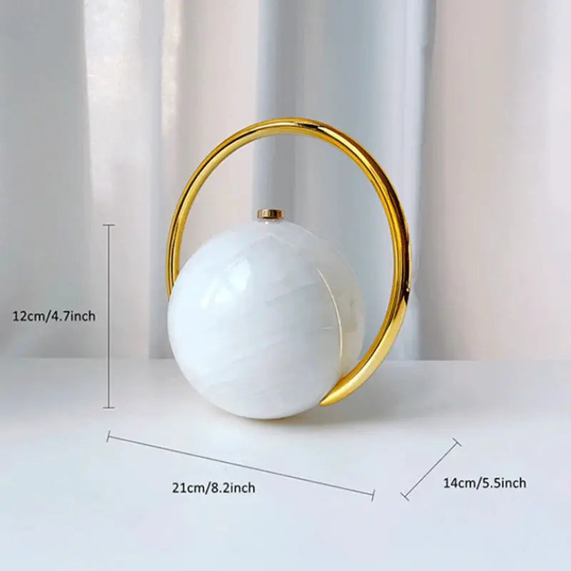 Luxury acrylic evening clutch with gold ring handle; white spherical handbag by Simples Market for weddings and parties