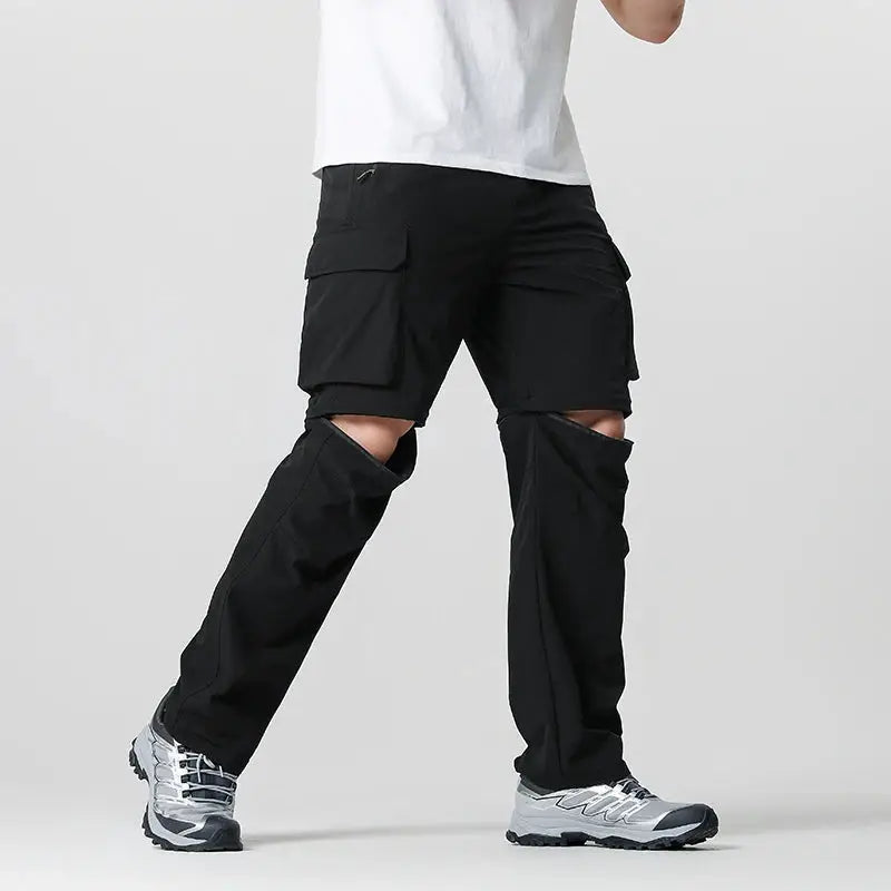 Men's black cargo hiking pants with large side cargo pockets for outdoor adventures.
