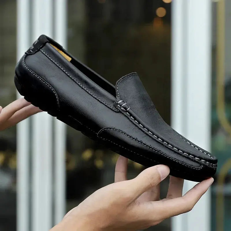 Men's black genuine leather slip-on loafers with moccasin stitching