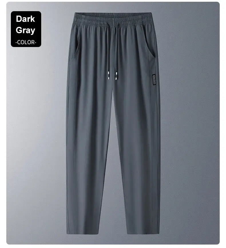 Dark gray running pants in ice silk fabric with drawstring waist and side pockets.