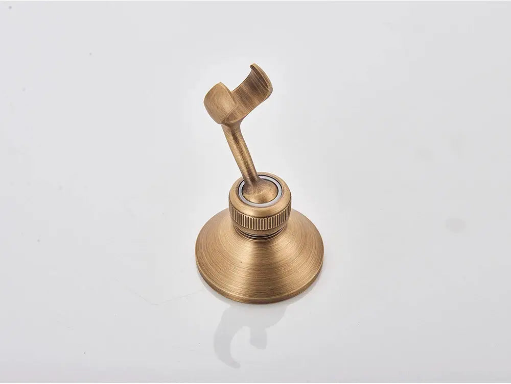 Antique brass handheld shower head bracket with curved holder and round base