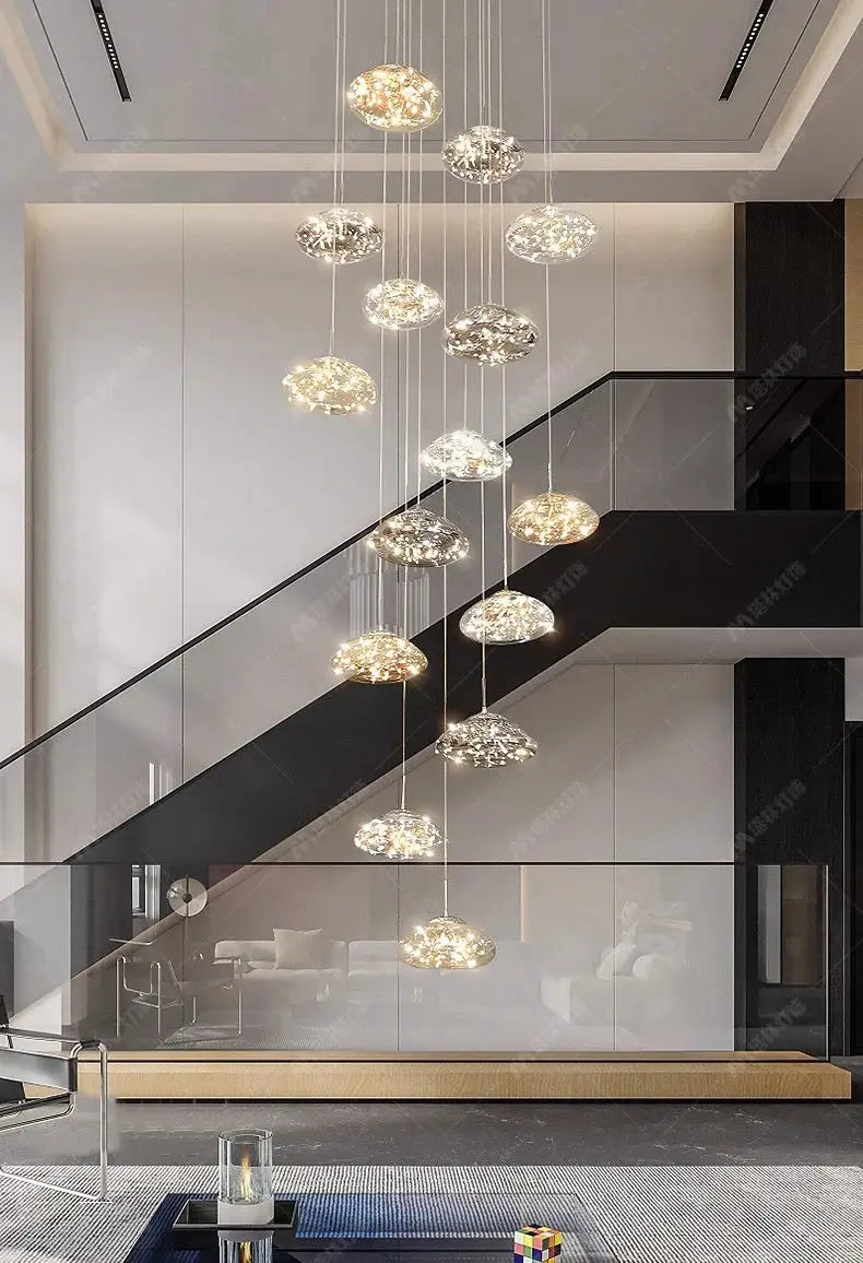 Modern dining room pendant lights, cluster of 12 clear glass orbs on slim cords, warm LED glow.