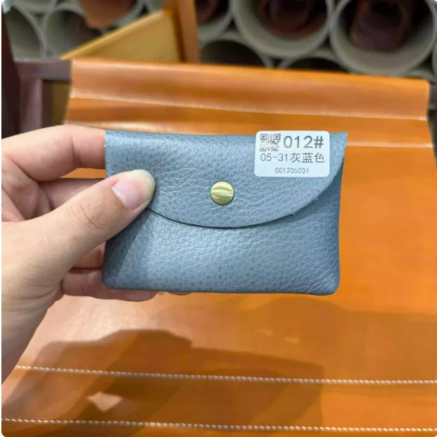 Simples Market blue genuine leather card holder with brass snap; compact mini envelope for business cards.
