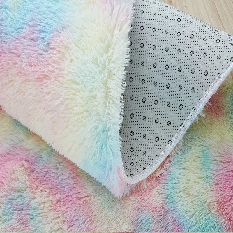 Kids rainbow colors shag rug; soft plush texture with non-slip dotted underside.