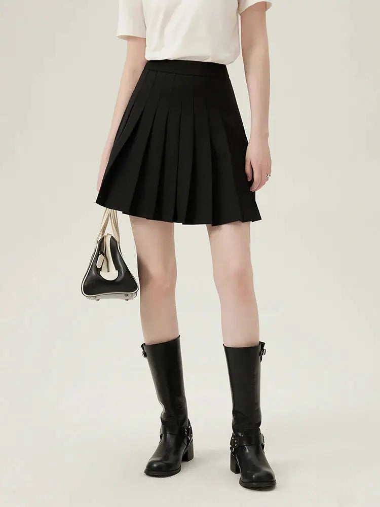 FSLE women's blazer set, 4-piece: black pleated skirt, white top, knee-high black boots, and black-and-beige handbag.