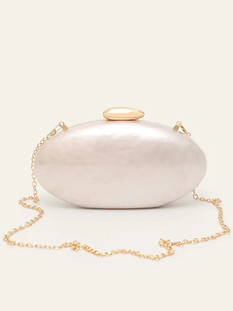 Women’s evening clutch in pearlescent acrylic, oval shape with gold top clasp and chain strap.
