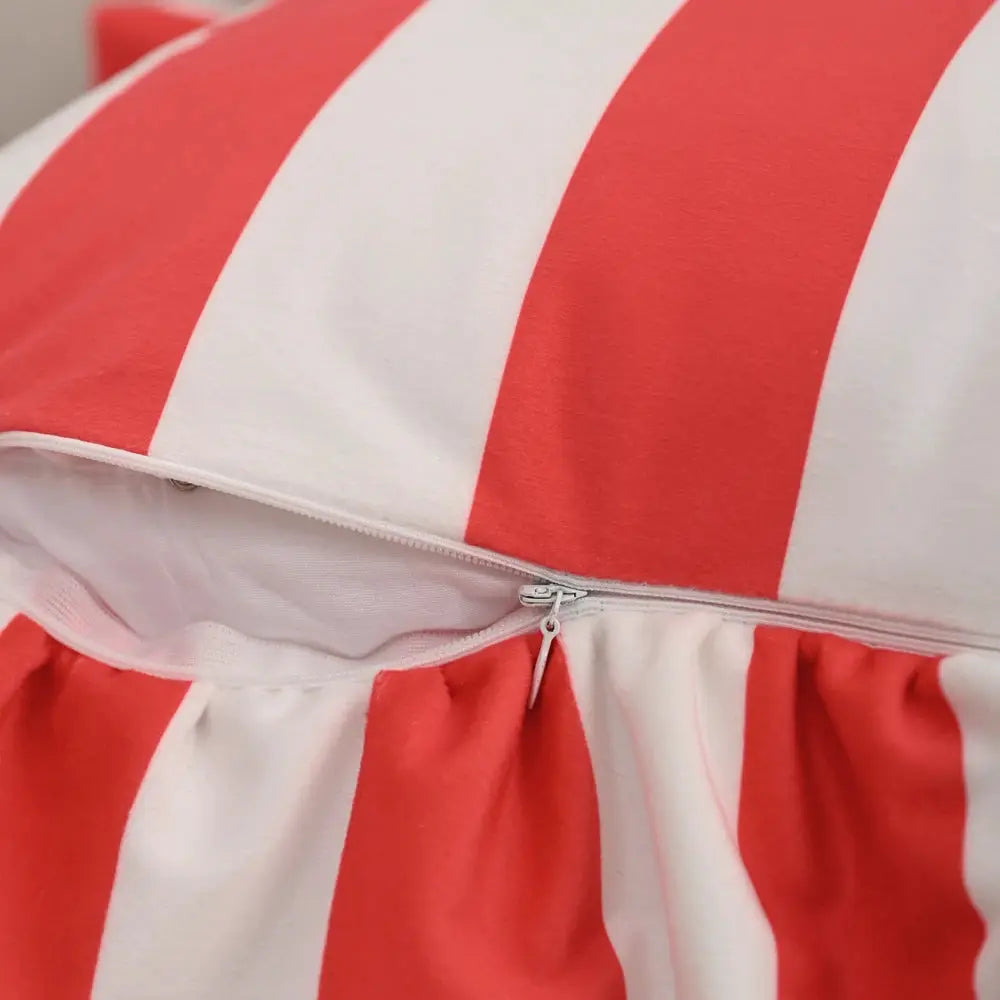 Striped velvet pillowcase in red and white with visible zipper closure