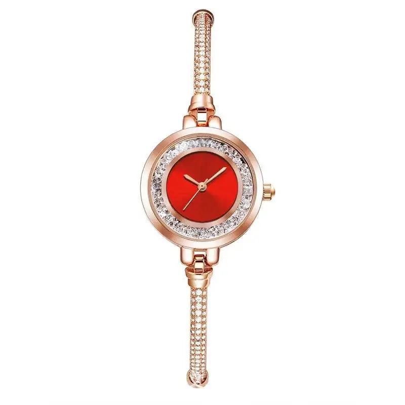 Women's rose gold-tone wristwatch with crystal bezel and red dial on a slim bracelet