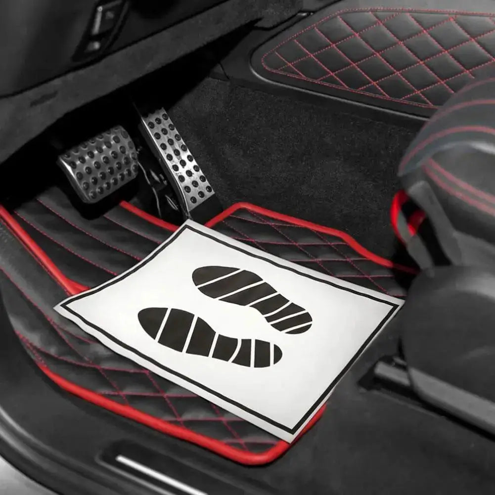 Disposable car floor mats, black with red stitched border, waterproof interior protection