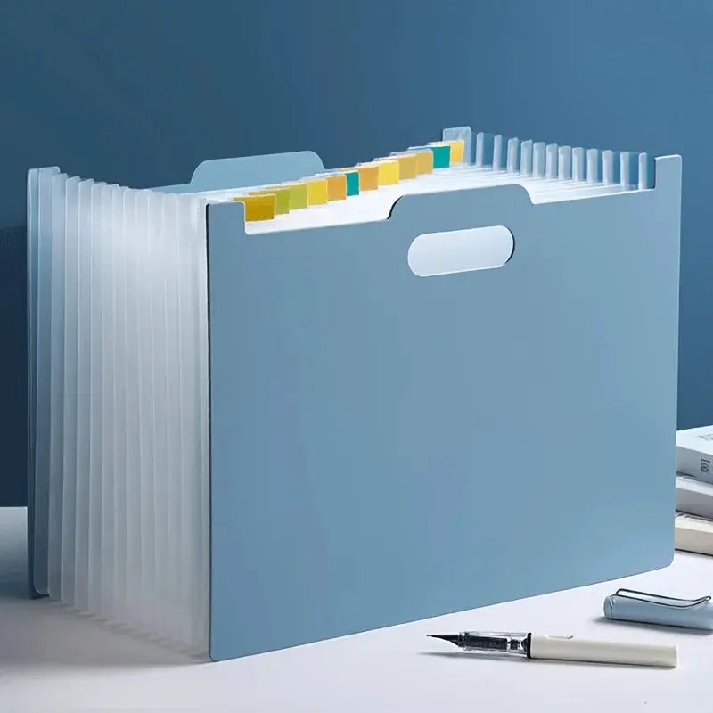 Foldable A4 file storage box by Simples Market, blue desktop organizer with multiple pockets and color-coded tabs.