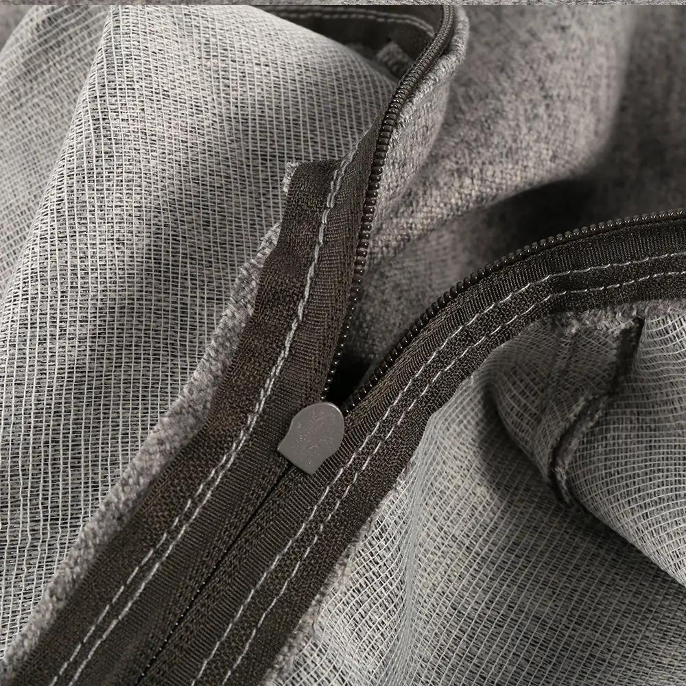 Bean bag chair cover in grey textured fabric with brown zipper closure, close-up of stitching and weave