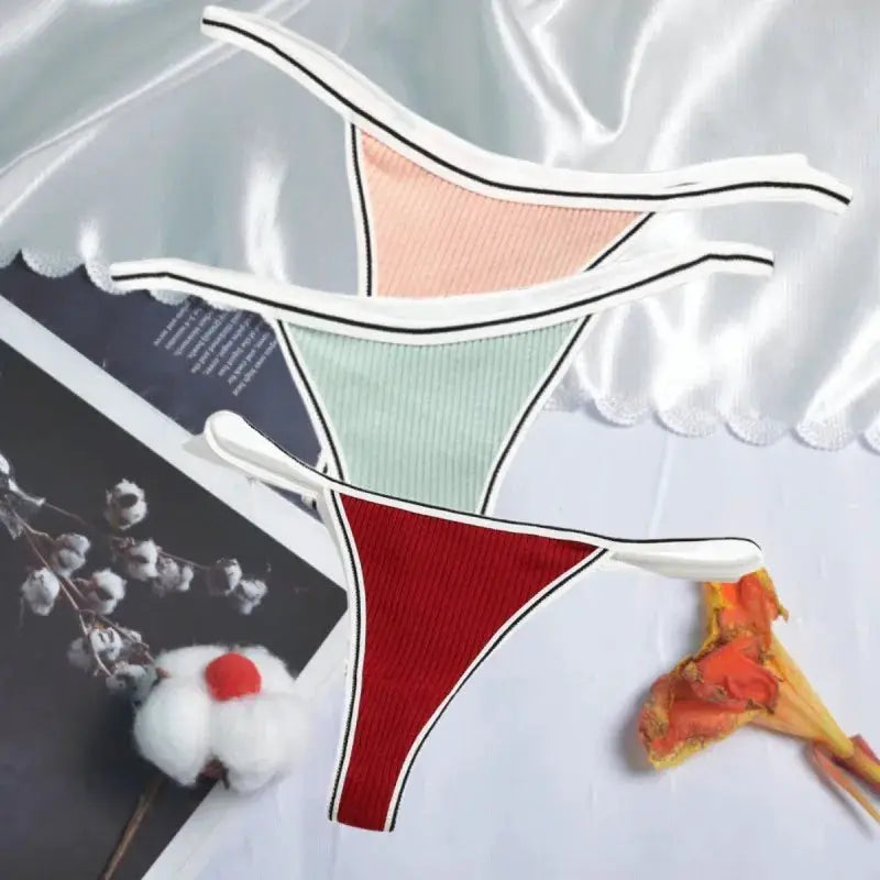 Women's cotton thong underwear set by Simples Market; seamless low-waist G-strings in peach, mint green and red.