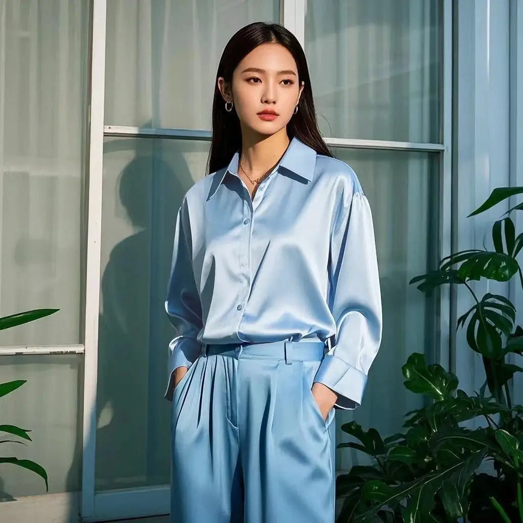 Satin blue shirt and matching pants set; light-blue officewear for women