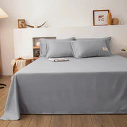 Gray bed flat sheet for double bed; solid color with matching pillowcases, Simples Market, Halo tag visible.