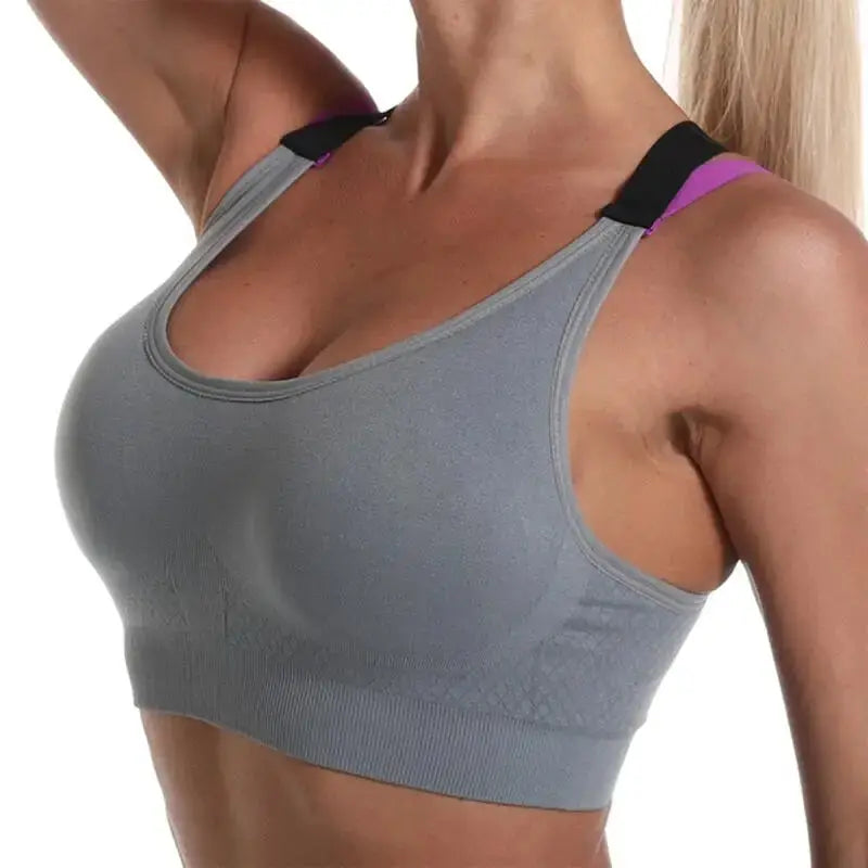 Color-blocked crossback gray sports bra by Simples Market with black and purple straps; wireless