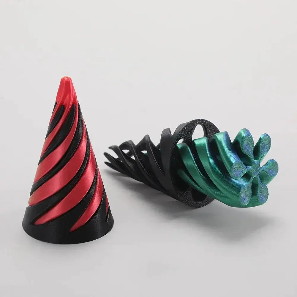 Two 3D-printed helix screw rotating toys; red-and-black cone and teal-green spiral sculpture for home decor