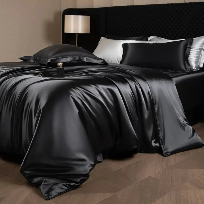 Silk satin bedding set in black with duvet cover, fitted and flat sheets, and pillowcases