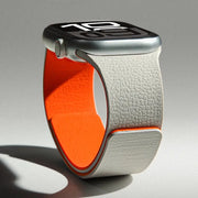Simples Market silicone magnetic Apple Watch strap with white textured exterior and orange inner lining