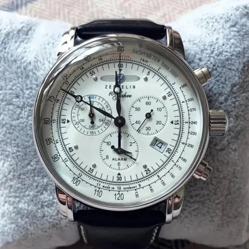 Zeppelin commemorative men's automatic watch with silver case, white dial, tachymeter bezel and black leather strap