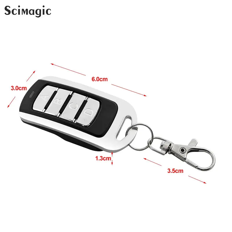 Four-button garage door remote keychain, white body with black center and silver buttons, Scimagic